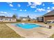 Outdoor pool with diving board and concrete features metal ladder access with nearby storage shed at 130 Ketchie Dr, Mooresville, NC 28115