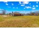 Rear exterior view with pool, patio and brick home at 130 Ketchie Dr, Mooresville, NC 28115