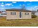 Outdoor storage shed has two windows with shutters and one front door at 130 Ketchie Dr, Mooresville, NC 28115