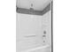 Bright, all-white shower featuring black striped wallpaper accents at 130 Ketchie Dr, Mooresville, NC 28115