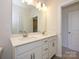 Bathroom with double vanity, ample storage, and well-lit mirror, creating a luxurious space at 1307 Cerium Way, Charlotte, NC 28211