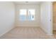 Bright bedroom with plush carpet and large windows at 1307 Cerium Way, Charlotte, NC 28211