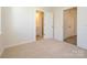 Bedroom showing neutral carpet and two doors at 1307 Cerium Way, Charlotte, NC 28211