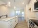 The kitchen showcases white cabinets, marble countertops, stainless appliances, and wood-look flooring at 1307 Cerium Way, Charlotte, NC 28211