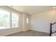 Well-lit living area with large windows and modern staircase detail at 1307 Cerium Way, Charlotte, NC 28211