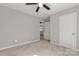 Bedroom with neutral carpet, overhead fan, and door to an adjacent room at 1311 Mack Dr, McConnells, SC 29726