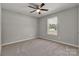 Bedroom featuring neutral carpet and a bright window, perfect for relaxation at 1311 Mack Dr, McConnells, SC 29726