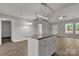 Kitchen island featuring granite countertops and a contemporary pendant light fixture at 1311 Mack Dr, McConnells, SC 29726