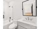 Modern bathroom with a shower and tub combo, sleek vanity, and updated fixtures at 144 Sardis Ln, Charlotte, NC 28270
