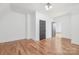 Spacious bedroom featuring hardwood floors and gray doors leading to other areas at 144 Sardis Ln, Charlotte, NC 28270