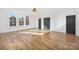 Large bedroom with multiple windows and beautiful hardwood floors at 144 Sardis Ln, Charlotte, NC 28270
