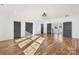 Bonus room with natural sunlight, multiple doors, and hardwood flooring at 144 Sardis Ln, Charlotte, NC 28270
