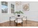 Charming dining area with modern table, stylish chairs, and ample natural light at 144 Sardis Ln, Charlotte, NC 28270