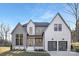 Beautiful two-story home showcasing modern architectural design and eye-catching curb appeal with a three-car garage at 144 Sardis Ln, Charlotte, NC 28270