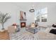 Stylish living room with a cozy fireplace, large windows, and elegant interior design elements at 144 Sardis Ln, Charlotte, NC 28270