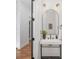 Modern powder room with a stand sink, designer mirror, and stylish accents at 144 Sardis Ln, Charlotte, NC 28270