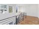 A staircase landing with detailed trim and railing with an abundance of natural light at 144 Sardis Ln, Charlotte, NC 28270