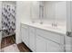 Bright bathroom with double sink vanity, sleek white cabinets, and modern faucets at 1461 Forkhorn Dr, Monroe, NC 28110