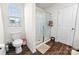 Well-lit bathroom featuring a glass-enclosed shower, modern toilet, and wood-look flooring for a clean design at 1461 Forkhorn Dr, Monroe, NC 28110