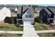 Charming two-story home with manicured lawn and welcoming two-car garage at 1461 Forkhorn Dr, Monroe, NC 28110