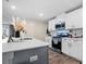 Modern kitchen featuring an island with a sink, white cabinets, and stainless steel appliances at 1461 Forkhorn Dr, Monroe, NC 28110