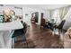 Modern kitchen featuring a large island with bar seating, stainless steel appliances, and hardwood floors at 1461 Forkhorn Dr, Monroe, NC 28110