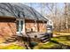Spacious backyard deck with seating, grill, and steps leading to lush lawn at 1601 Rosegate Ln, Stanfield, NC 28163