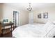 Bedroom featuring a spacious closet, hardwood floors, natural lighting, and hanging art at 1601 Rosegate Ln, Stanfield, NC 28163