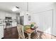 Cozy eat-in kitchen featuring stainless steel appliances, white cabinetry, and a modern light fixture at 1601 Rosegate Ln, Stanfield, NC 28163