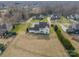 Aerial view of the backyard with a lawn and surrounding trees at 2027 Gloucester St, Matthews, NC 28104
