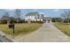 Exterior view of a two-story home with a long driveway and large front yard at 2027 Gloucester St, Matthews, NC 28104