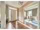 Inviting foyer featuring hardwood floors, natural light, and an open view to the study at 2027 Gloucester St, Matthews, NC 28104