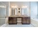 Bright main bathroom with dual sinks, vanity and cabinetry, a walk-in shower, and a soaking tub at 2027 Gloucester St, Matthews, NC 28104