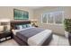 Comfortable bedroom featuring a large window with natural light and stylish, contemporary decor at 2027 Meadowood Ln, Charlotte, NC 28211