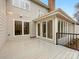 Wooden deck area showcasing sunroom, with railings, and access to outdoor space at 2027 Meadowood Ln, Charlotte, NC 28211