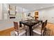 Formal dining room featuring a large window, view of the fireplace and an adjacent room with built-ins at 2027 Meadowood Ln, Charlotte, NC 28211