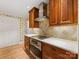 Updated kitchen with stainless steel appliances, custom cabinets, and bright lighting at 2027 Meadowood Ln, Charlotte, NC 28211