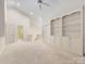 Bright living room with vaulted ceilings, neutral decor, and a built-in bookcase at 2027 Meadowood Ln, Charlotte, NC 28211