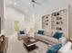 Inviting living room with vaulted ceilings, neutral decor, and built-in shelving at 2027 Meadowood Ln, Charlotte, NC 28211