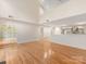 Bright living room with hardwood floors and arched doorway at 2027 Meadowood Ln, Charlotte, NC 28211