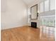 Bright living room with hardwood floors, fireplace, and lots of natural light at 2027 Meadowood Ln, Charlotte, NC 28211