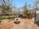 Outdoor patio featuring stone flooring, iron fencing, and garden views, perfect for entertaining at 2027 Meadowood Ln, Charlotte, NC 28211