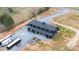 Stunning aerial view of a black barndominium-style home with a metal roof and gravel driveway at 2288 Boheler Rd, Clover, SC 29710