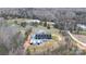 A sprawling aerial view showcases the stunning property with its modern farmhouse, nestled in a picturesque landscape at 2288 Boheler Rd, Clover, SC 29710