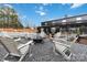 Beautiful backyard featuring a fire pit area, gravel landscaping, and serene outdoor space at 2288 Boheler Rd, Clover, SC 29710