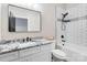 Modern bathroom with white subway tiles, dark fixtures, and a vanity with a granite countertop at 2288 Boheler Rd, Clover, SC 29710
