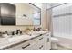 Bathroom with double sink vanity, granite countertop, white cabinets, and decorative mirror at 2288 Boheler Rd, Clover, SC 29710