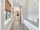 Inviting hallway with polished floors, board and batten wainscoting, and a cozy built-in bench at 2288 Boheler Rd, Clover, SC 29710