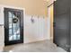 Hallway with board and batten, a barn door, and a glimpse of a room visible through the glass door at 2288 Boheler Rd, Clover, SC 29710