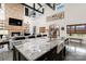 Open-concept kitchen with granite counters and brick fireplace seamlessly connects living and dining areas for easy entertaining at 2288 Boheler Rd, Clover, SC 29710